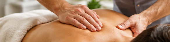 Myotherapist treating a client's back